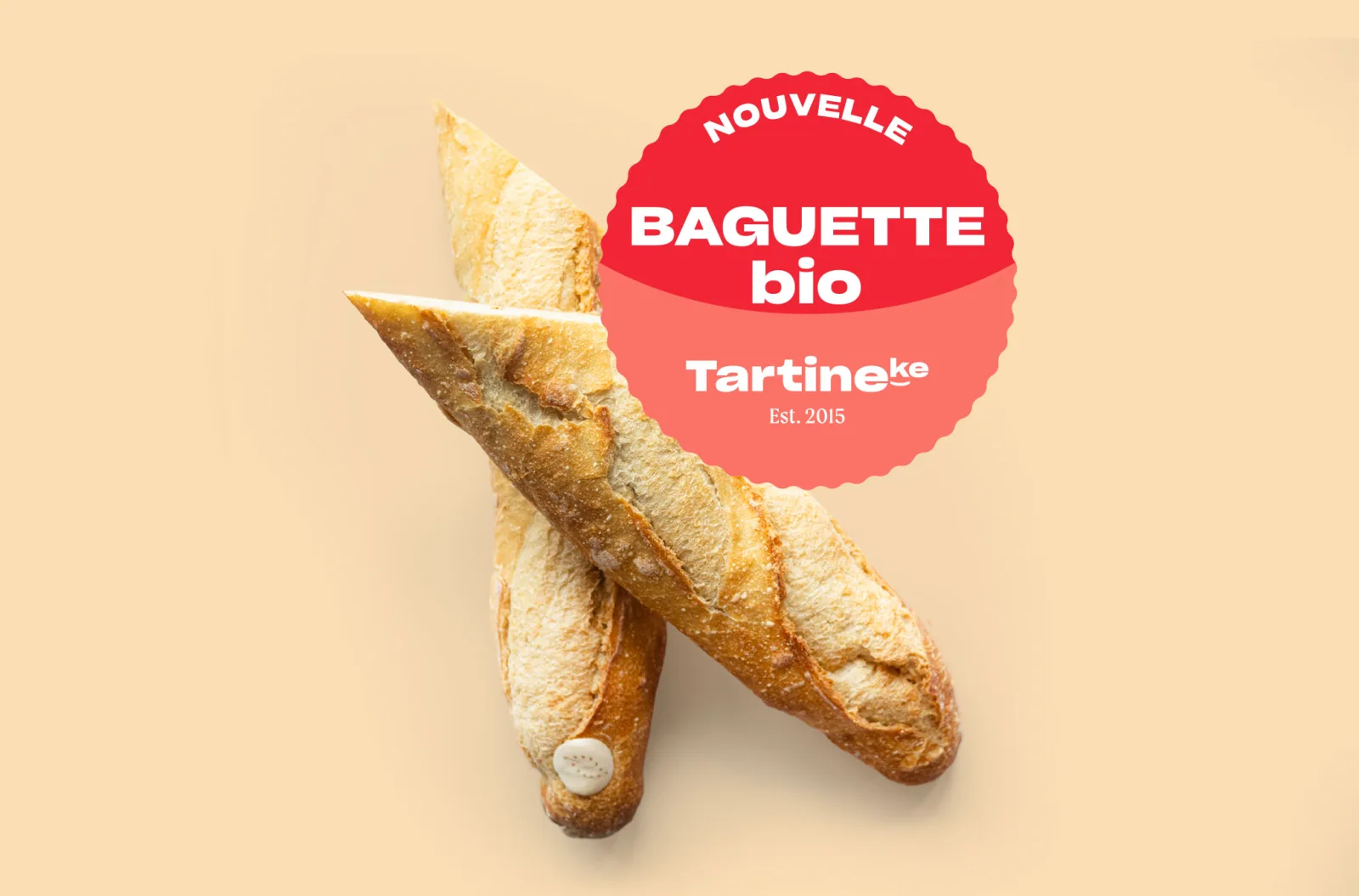 Twee bio zuurdesembaguettes van Tartineke met de badge nieuwe bio baguette, ambachtelijke sandwicherie in Waver